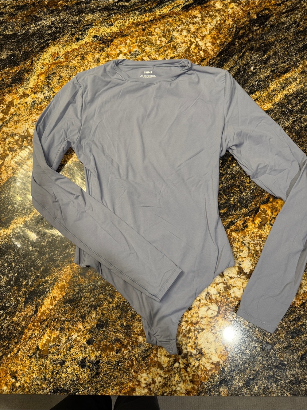 skims light blue body suit
